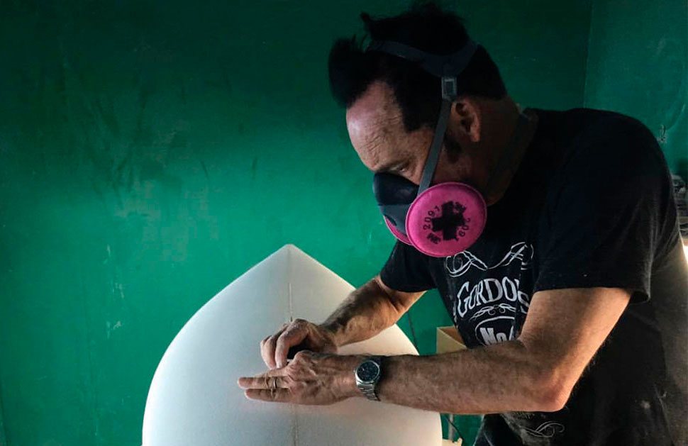 Jeff “Doc” Lausch shaping a surfboard