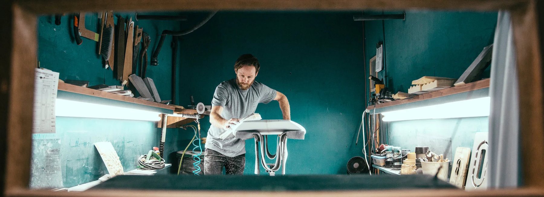 Ryan Sakal shaping a surfboard